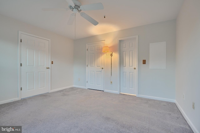 empty room with light carpet and ceiling fan