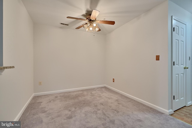 carpeted empty room with ceiling fan