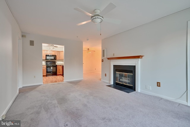 unfurnished living room with light carpet and ceiling fan