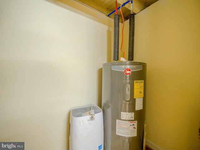 utility room featuring electric water heater