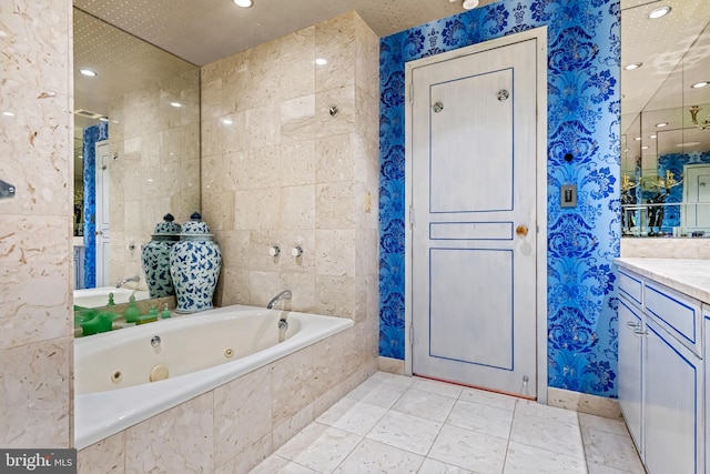 bathroom with vanity and separate shower and tub