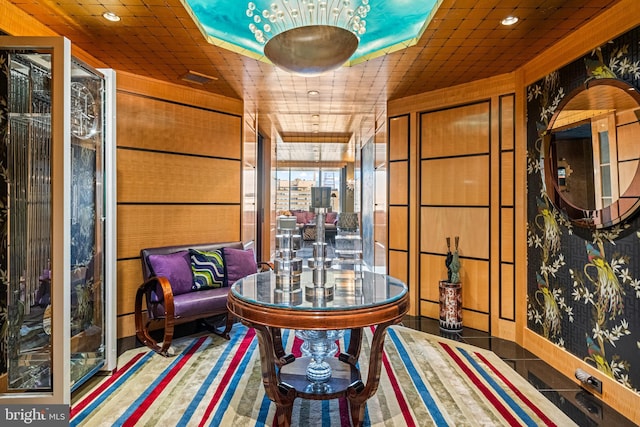 sitting room with wood walls