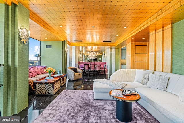 tiled living room with a chandelier