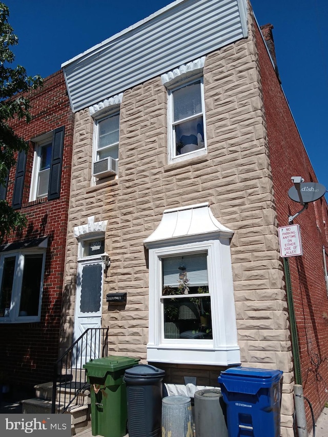 view of front of property featuring cooling unit