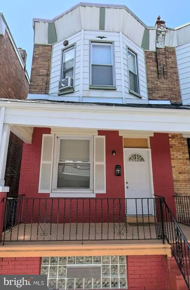 view of front of home featuring cooling unit