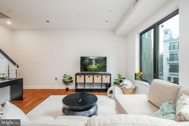 living room with light hardwood / wood-style flooring