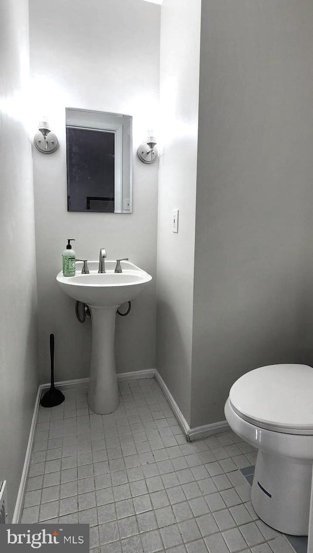 bathroom featuring tile patterned floors and toilet