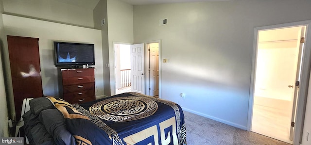 carpeted bedroom featuring high vaulted ceiling