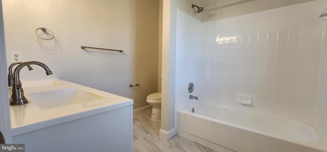 full bathroom featuring toilet, tiled shower / bath combo, and vanity