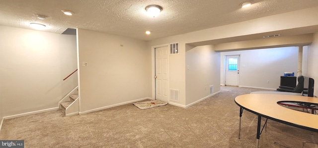 office area with carpet and a textured ceiling