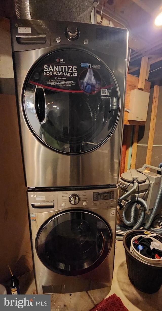 laundry area featuring stacked washer and clothes dryer