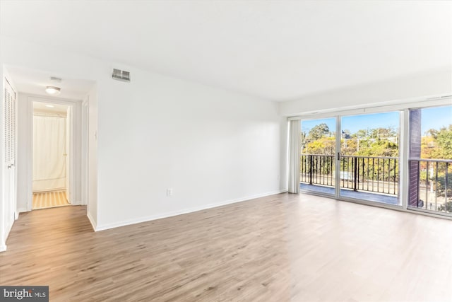 spare room with light wood-type flooring