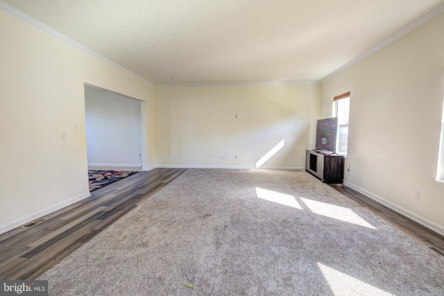 unfurnished living room featuring crown molding and dark hardwood / wood-style floors