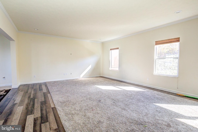 unfurnished room with crown molding and hardwood / wood-style flooring