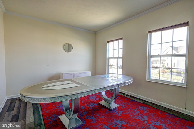 dining space featuring crown molding and wood-type flooring