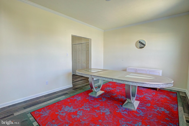 dining area with crown molding and dark hardwood / wood-style floors