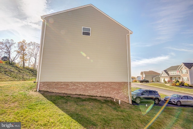 view of property exterior featuring a yard