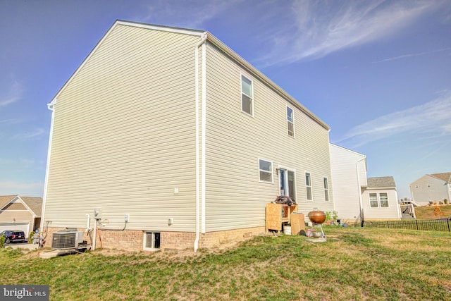 view of side of property with cooling unit and a yard