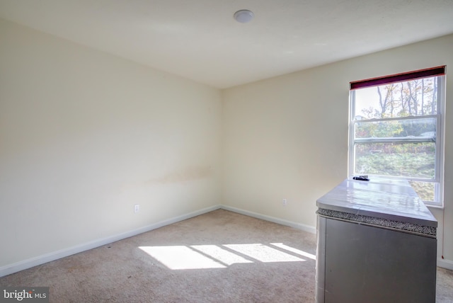 empty room with light colored carpet