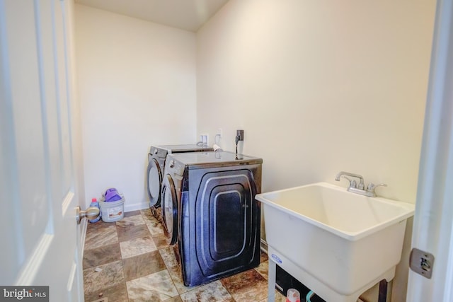 laundry area with sink and washer and dryer