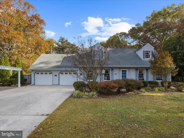 cape cod home with a garage and a front lawn