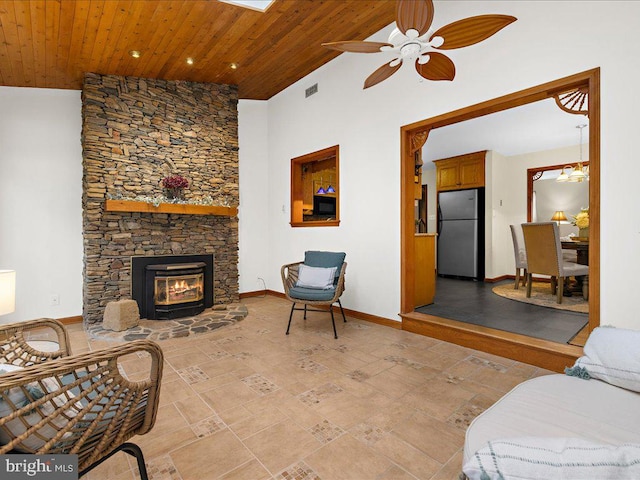 living room with wooden ceiling, ceiling fan, and vaulted ceiling