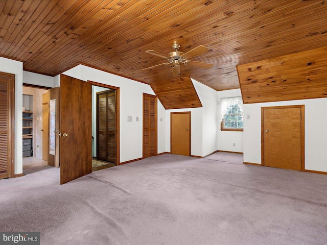 additional living space featuring lofted ceiling, light colored carpet, ceiling fan, and wooden ceiling