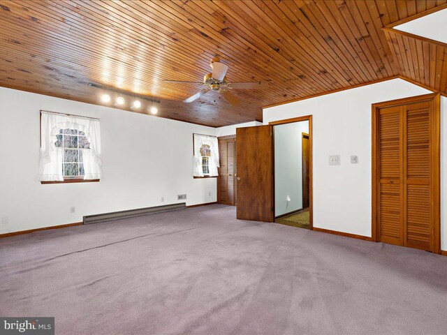 carpeted empty room with lofted ceiling, wooden ceiling, ceiling fan, and a baseboard radiator