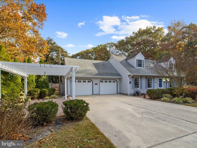 cape cod house featuring a garage