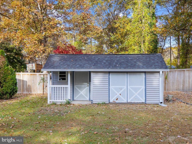 view of outdoor structure featuring a yard