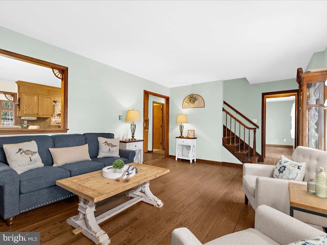 living room featuring dark wood-type flooring