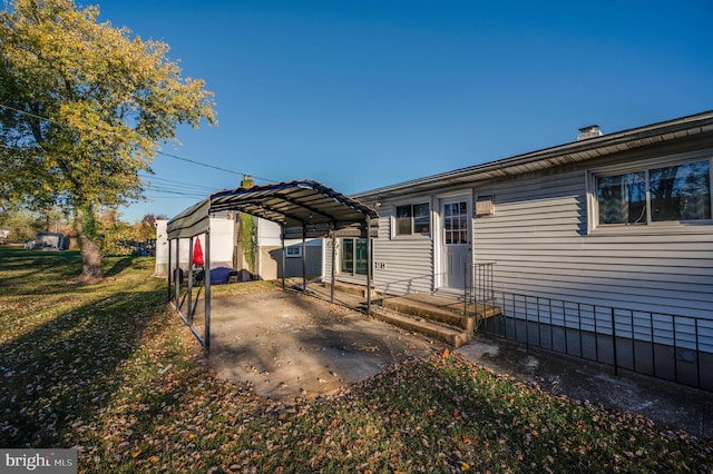 view of front of house with a front yard and a carport