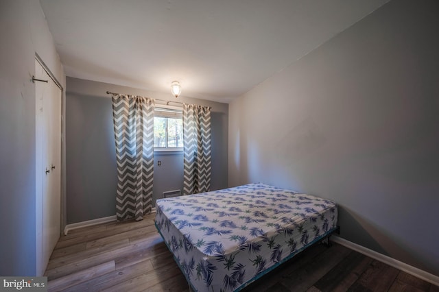 bedroom featuring hardwood / wood-style floors