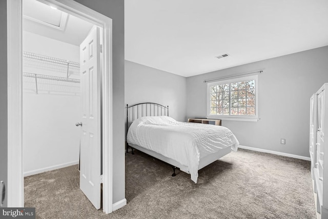 carpeted bedroom with a closet