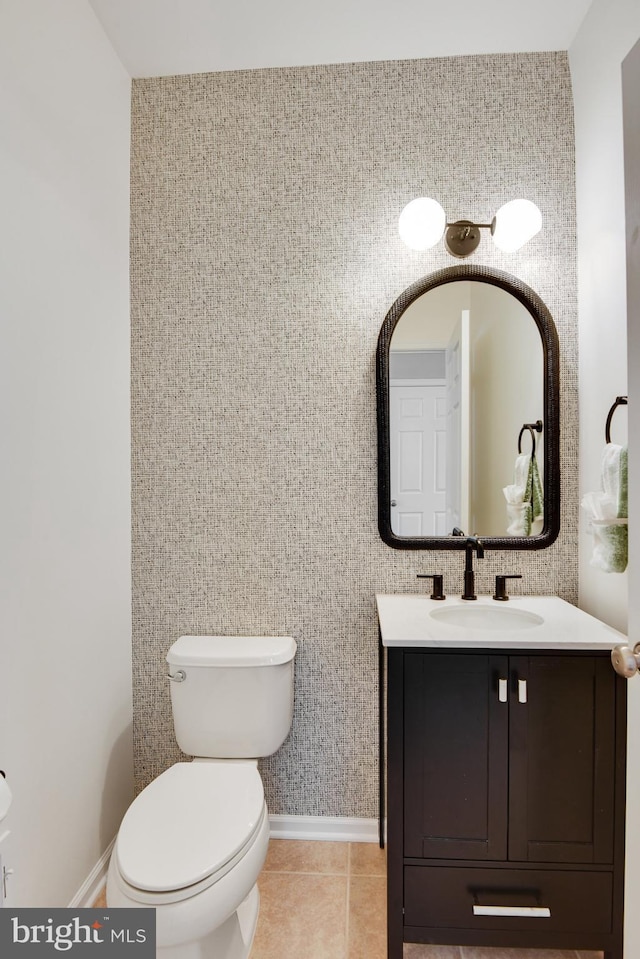 bathroom featuring vanity, toilet, and tile patterned floors