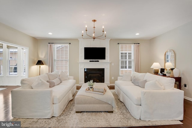 living room featuring hardwood / wood-style floors and an inviting chandelier