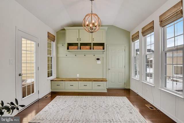 mudroom with dark hardwood / wood-style flooring, a chandelier, and vaulted ceiling