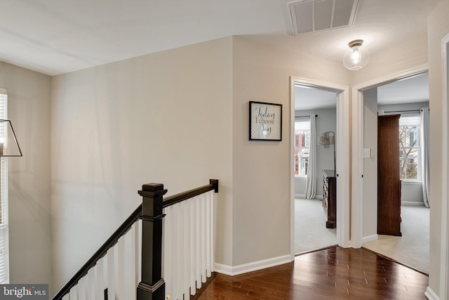 hall with dark wood-type flooring