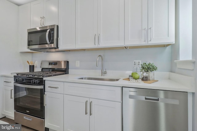 kitchen featuring sink, white cabinetry, and stainless steel appliances