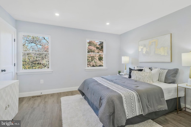 bedroom with light wood-type flooring