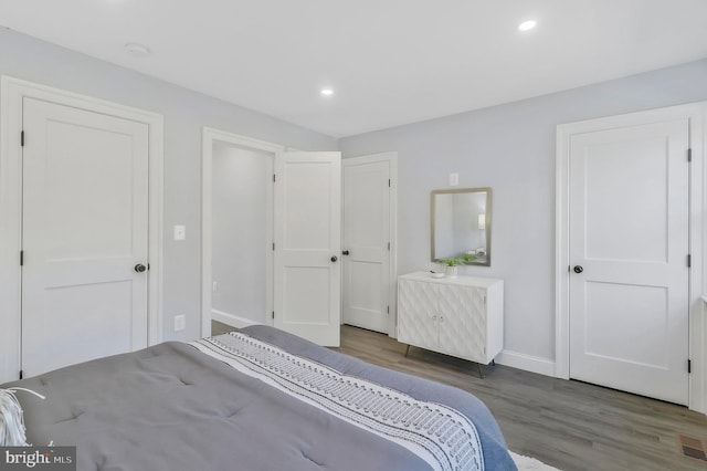 unfurnished bedroom featuring dark wood-type flooring