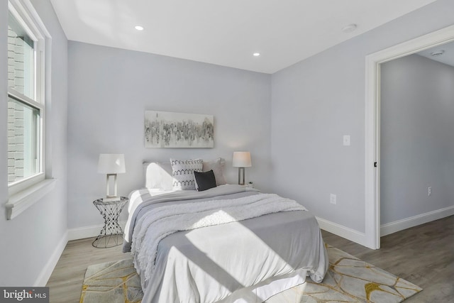 bedroom with light hardwood / wood-style flooring