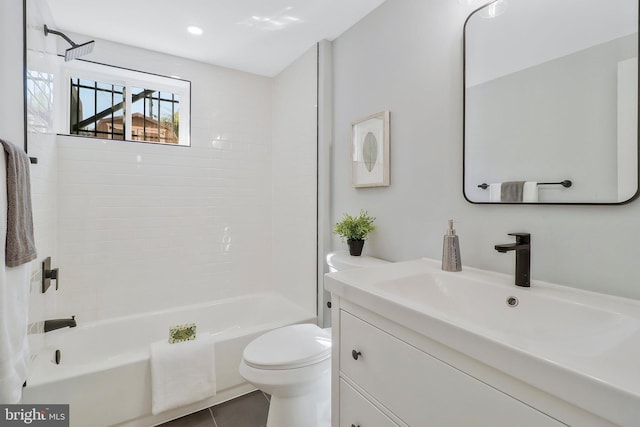 full bathroom featuring vanity, toilet, tile patterned floors, and tiled shower / bath combo