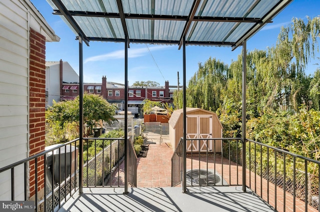 view of patio / terrace with a storage shed