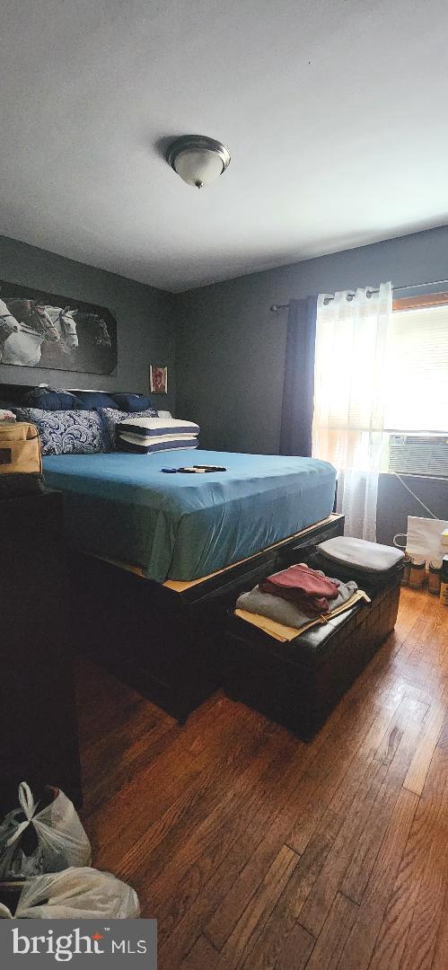 bedroom featuring wood-type flooring