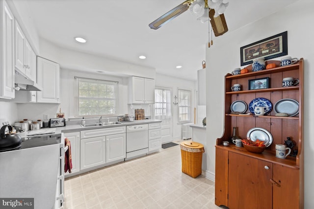 kitchen featuring white cabinetry, sink, white appliances, and ceiling fan