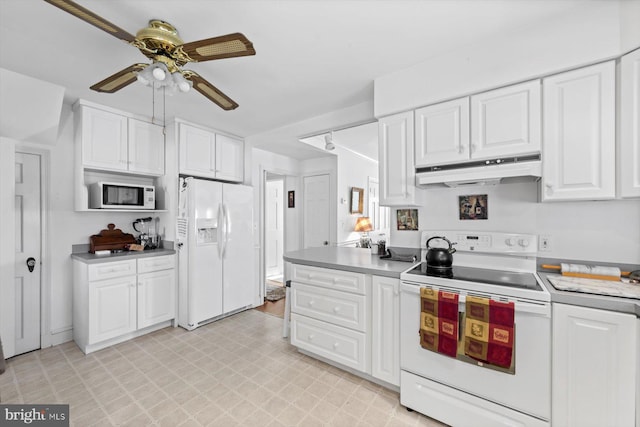 kitchen featuring white cabinets, ceiling fan, and white appliances