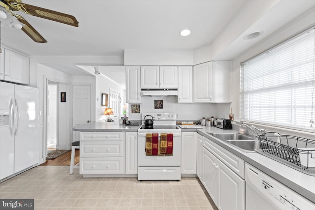 kitchen featuring kitchen peninsula, sink, ceiling fan, white cabinetry, and white appliances