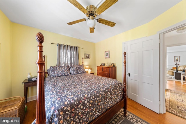 bedroom featuring hardwood / wood-style flooring and ceiling fan