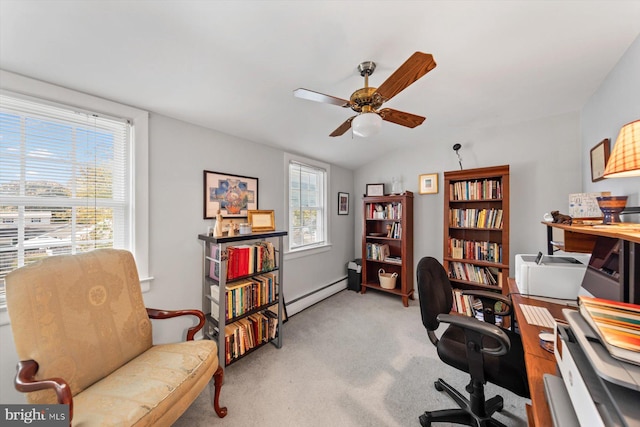 carpeted office space with a baseboard radiator, ceiling fan, and vaulted ceiling